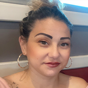 Headshot of Hispanic woman.