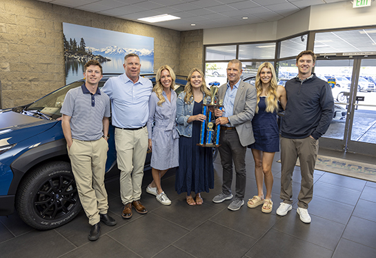 Dr. Randall presenting family with trophy